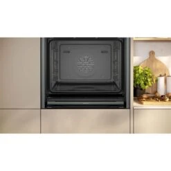 Neff N90 B64FT53G0B Bulit In Single Slide & Hide Electric Oven With Steam & Home Connect - Black With Graphite Grey Trim -Home Kitchen n e neff n90 b64ft53g0b slide and hide electric oven lifestyle3